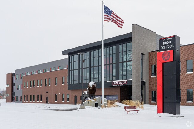 An American flag waves at the entrance to Lockwood High School.