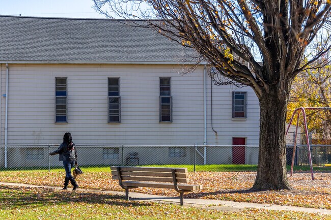 Johnston Playground offers a shaded path and basketball courts.