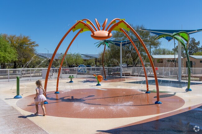 Every summer, kids enjoy the cool water at the splash pad at Purple Heart Park in Rita Ranch.