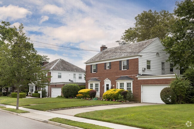 Two story center hall colonials are common in Lawrence, NY.