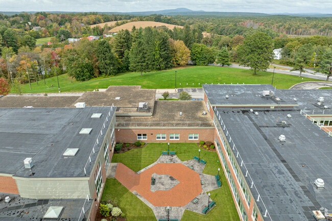 A courtyard with a patio and benches at Wachusett Regional High School.