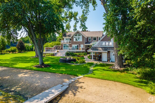 New traditional homes line Wauconda's waterfront featuring private docks and expansive yards.