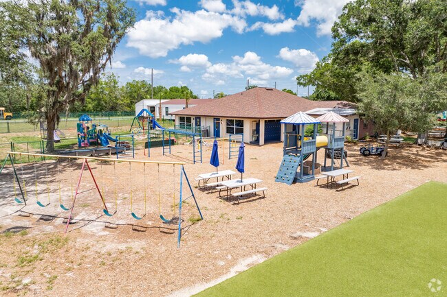 Kids enjoy playing on the play area at Genesis School.