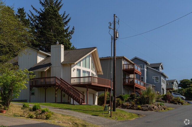 Depoe Bay's inlet homes feature a variety of coastal and craftsman styles with porch views.