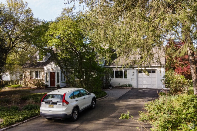 Cape Cod style home with plenty of trees for shade in Lawrence Township.