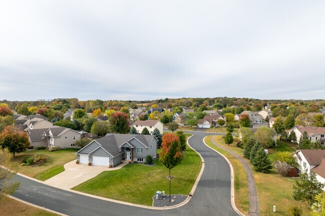 A quiet Mayer street is lined with homes and autumn foliage, perfect for evening walks and seasonal charm.