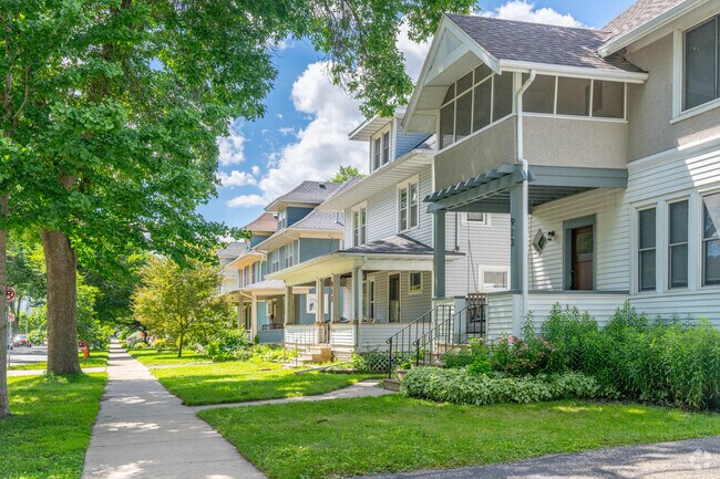 A view down the sidewalk with houses lining the street in the kutzky park neighborhood.