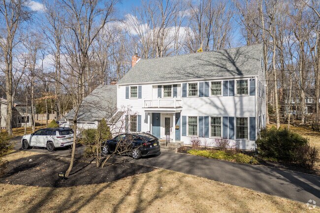 Many streets in Springdale are lined with large, single homes such as this Colonial Revival house.