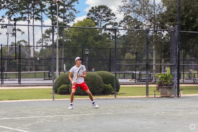 Doublegate residents enjoy playing tennis at the Country Club.