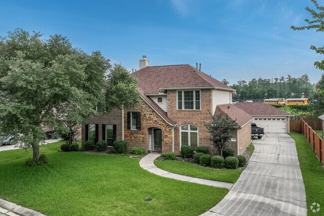 A two-story, Traditional-style home with a detached garage in Oak Ridge North.