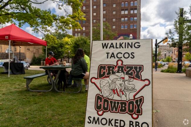 Queens locals enjoy lunch outside on a nice warm day.