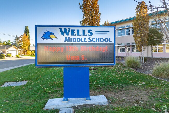 A view of the Wells Middle School sign from the street in Dublin, CA.