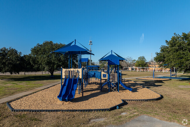 Spacious playground & green spaces provide opportunities for outdoor play & exploration.