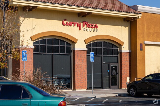 Enjoy unique Indian-inspired pizzas just a short drive from Murillo.