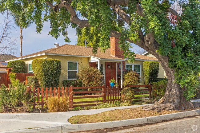 Beautiful trees and charming homes are found on the quiet streets of West Plaza.