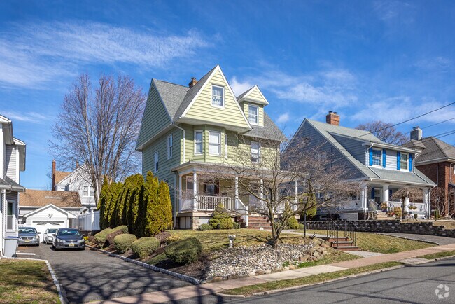 The house contributes to a picturesque suburban neighborhood with a distinct character.