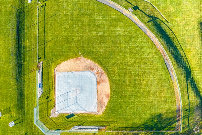 An aerial top-down view of the softball field at John P. Oldham Elementary School in Norwood, MA