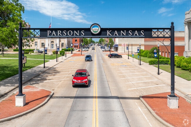 A welcome sign greets travelers in downtown Parsons.