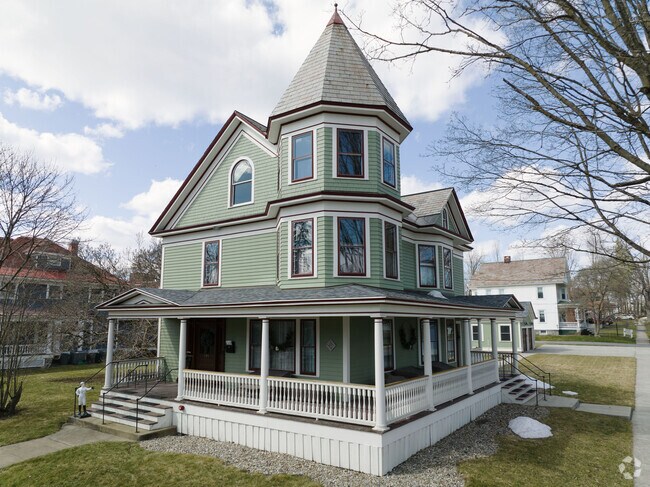 A classic Victorian home with a wrap around porch in Saratoga Springs.
