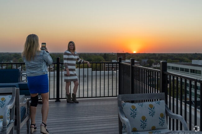 Greenleaf Manor locals take photos during a beautiful sunset.