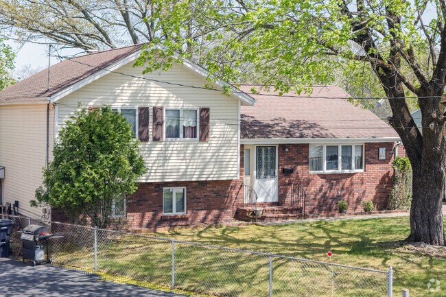 The more affordable homes in Valley Falls include traditional mid-century styles like this split-level house with a wonderful view.