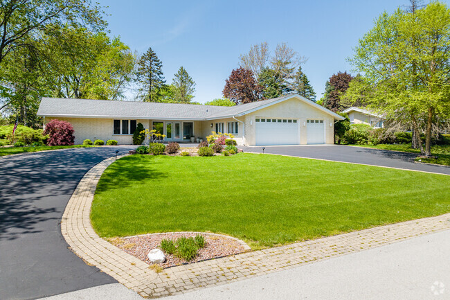 Among the various home styles in Creekside, some feature large horseshoe driveways.