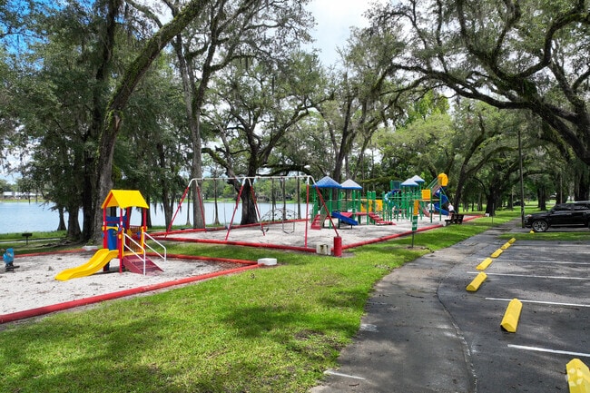 A colorful jungle gym anchors the play space at Lake Alice Park.