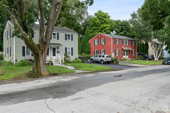 A row of colorful colonial homes lines the streets of Northwest New London.