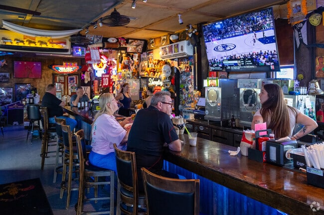 The River Shack Bar is a popular spot in Cypress Shores for waterside drinks and food.