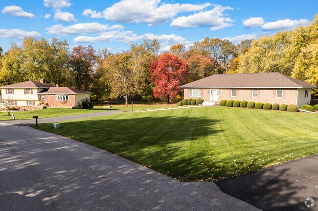 Homes with large manicured lawns are frequent in Penn Township.