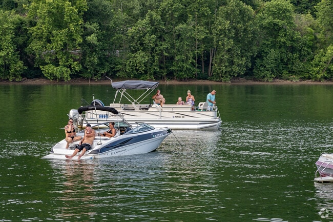 Friends and family lay out on their boats to enjoy live music during Rockin on the Mon.
