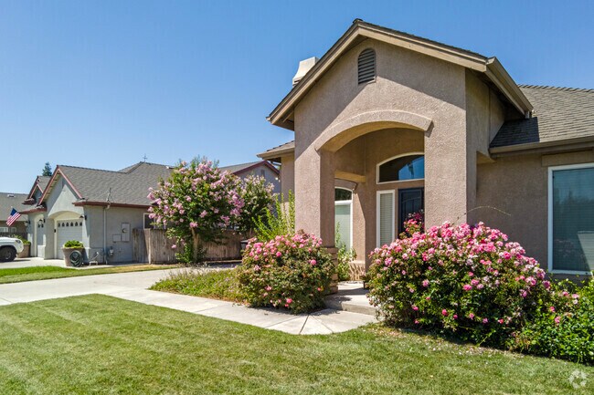 Flowers stand at the entry to a home in Hughson.