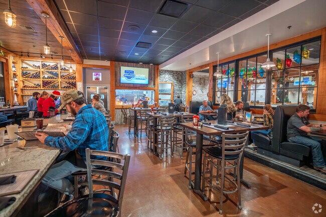 Residents enjoy a cozy ambiance at Fezzo's Seafood and Steakhouse in Scott, LA.