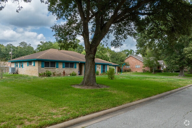 Ranch-style homes in Hillcrest are shaded by mature oak trees.