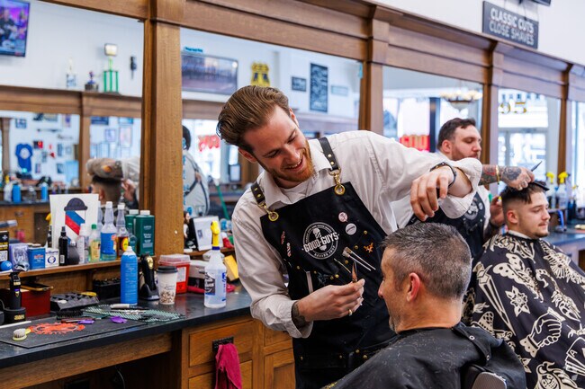 A man gets a trim at The Good Guys Barber Shop in Oswego NY.