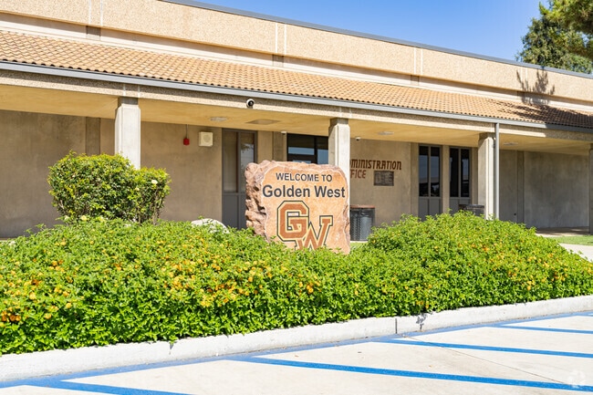 A newly installed stone sign welcomes students to the entrance of Golden West High School.