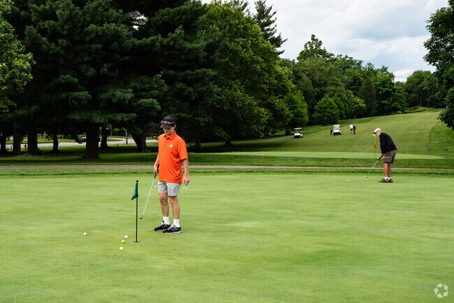 Practice putting before hitting the links at Crescent Hill Golf Course near Brownsboro Village.