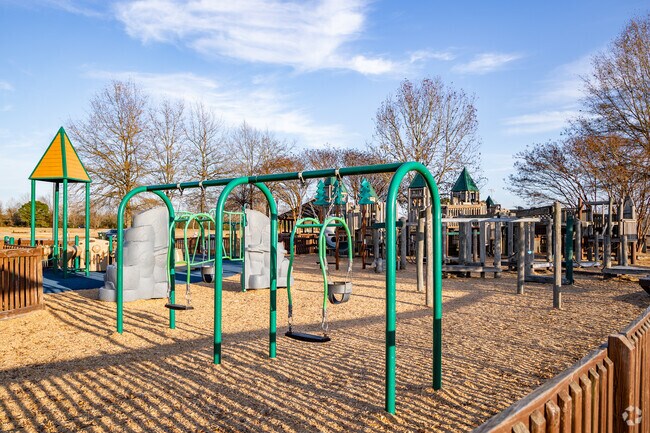 Kids of all ages play on the swings at All Kids Park.