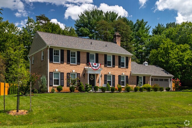 A massive colonial style home in nestled on a spacious lot in Flower Valley.
