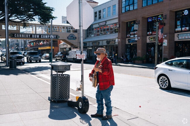 Street performers often play around Cannery Row in New Monterey.
