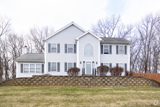 Find this striking modern home nestled within the landscape of Bradley Brook.