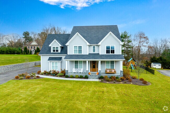 Homes in Daniel Farm District have nice porches large enough for the whole family.