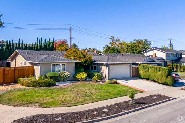 Homes in Strawberry Park feature tidy lawns and peaceful sidewalks.