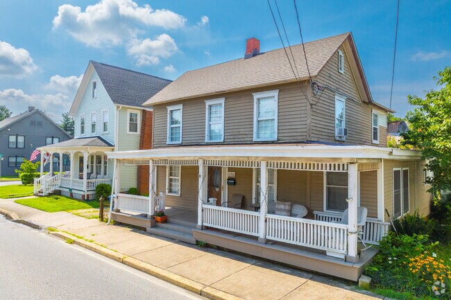 Colonial style homes line streets with covered front porches in Wyoming, DE.