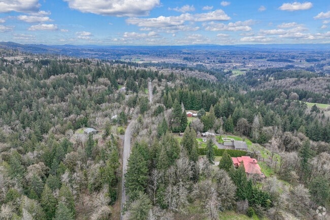 Aerial View of Large Acreage Properties Surrounded by Woods in Forest Park Portland.