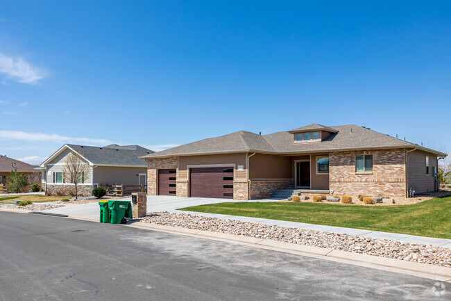 Luxurious brick ranch style home with multiple car garages line the streets in Brighton.