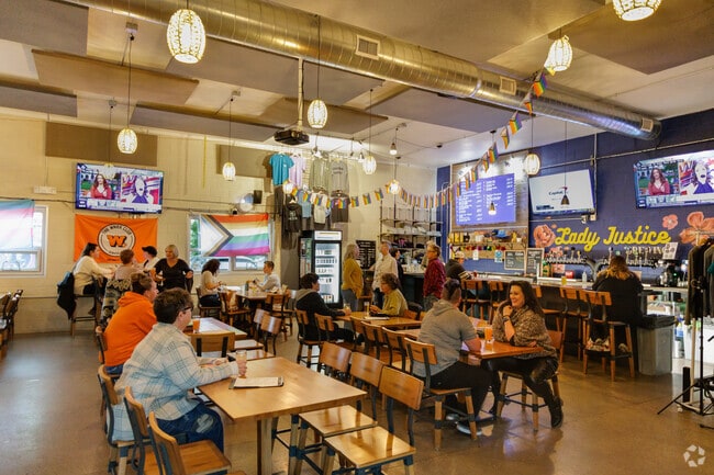 Friends flock to Lady Justice Brewing for a wide selection of beers in Cushing Park.
