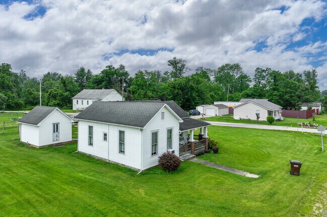 Homes in Patricksburg are modest and practical, often surrounded by open land and neighboring fields.
