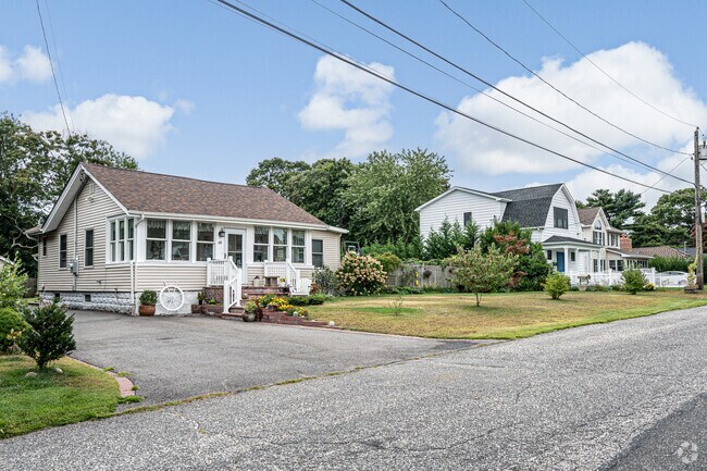 Various styles of homes is common on this street in Blue Point.