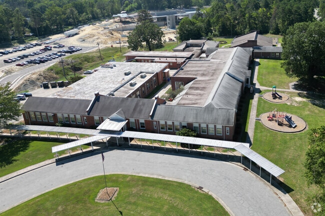 An aerial view of the school building with its playground. Clara J Peck Elementary School